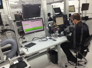 A RED technician installs  a Dragon sensor in a Clean Room on the NAB floor.